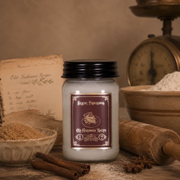 old fashioned candle with baking goods next to it.
