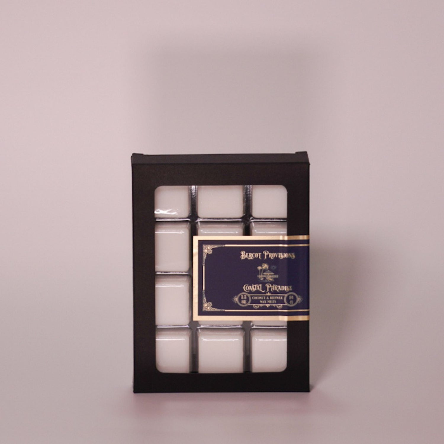 Pack of wax melts that smell like coconut in a black box from Bercot Provisions.
