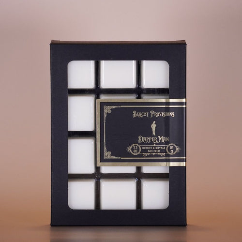 Box of white wax metls with a decorative label on a beige background