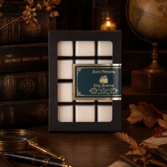 Dark Academia wax melts styled in a dark moody aesthetic background