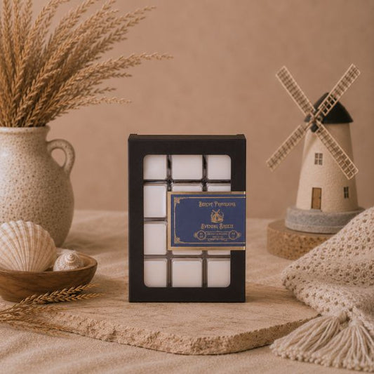 Decorative scene with candles in a holder, windmill model, and natural elements on a textured surface.